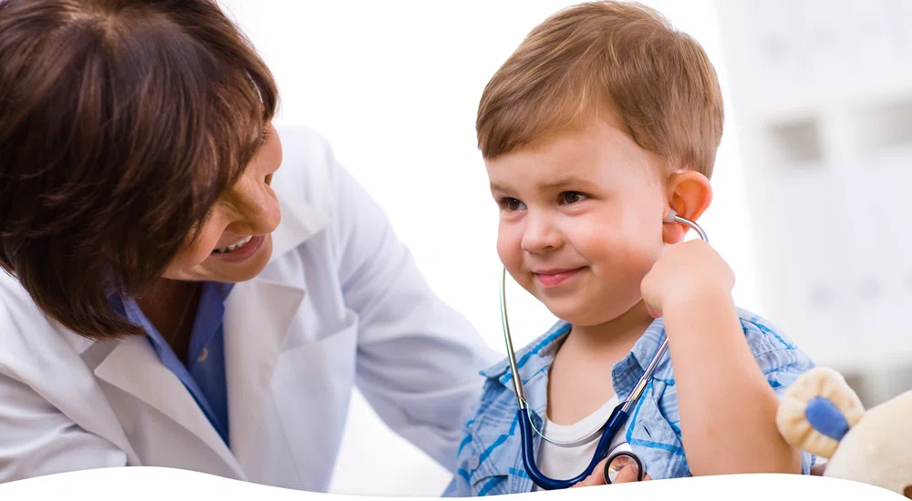 Boy and doctor with stethoscope